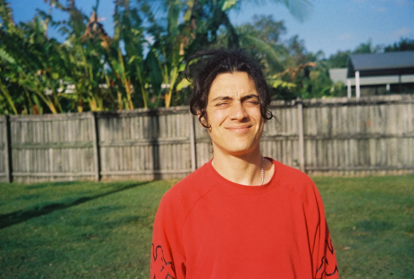 Zac Nedianu outdoors in a red shirt