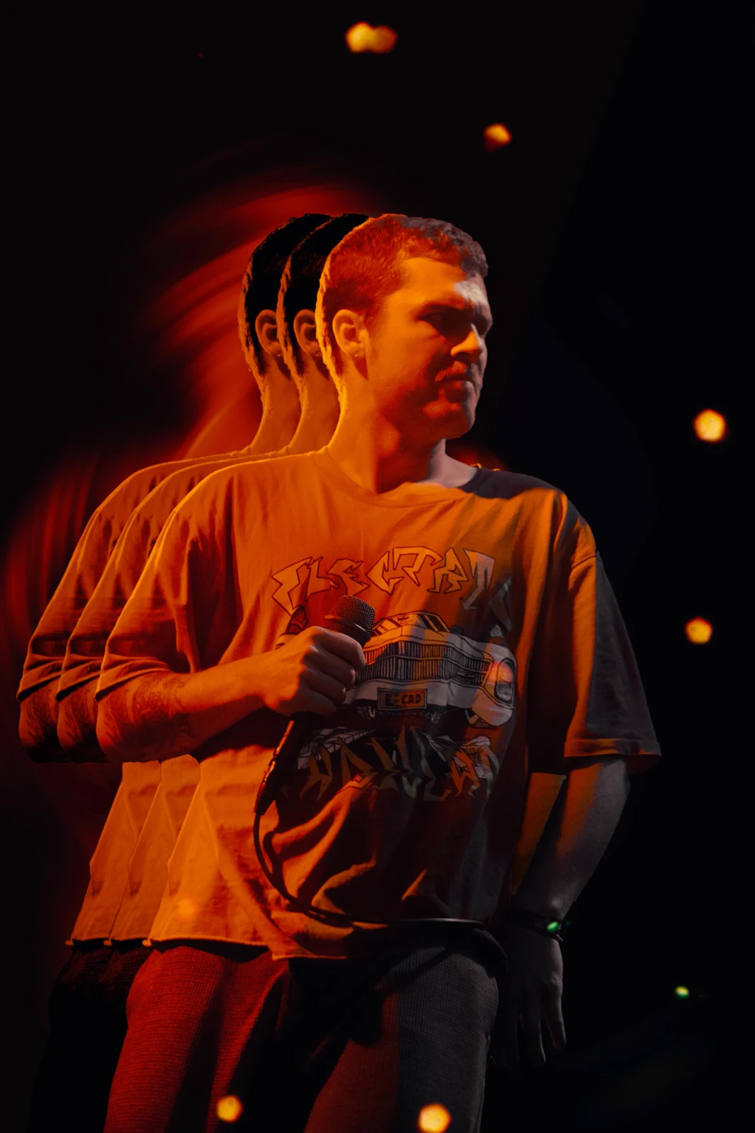CATPISS vocalist with an orange repeated-image treatment