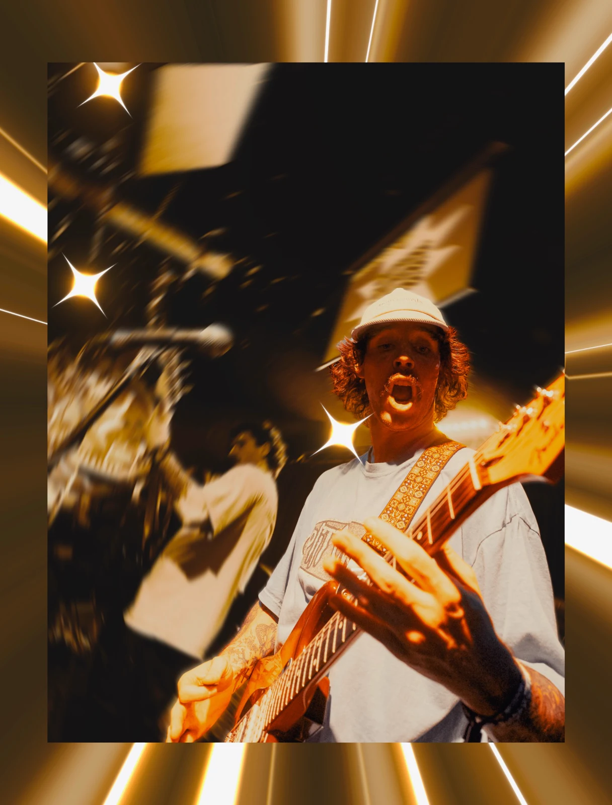 Close-up guitarist image with golden streaks and star effects