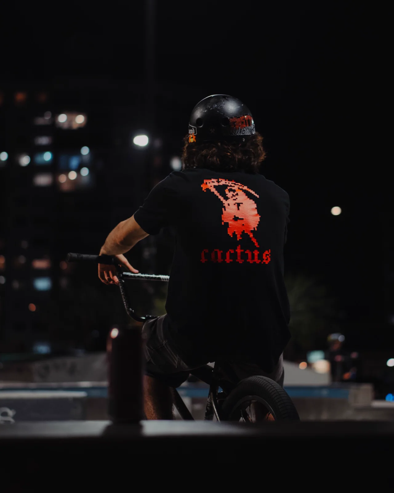 Lucas looking across the skate park at night