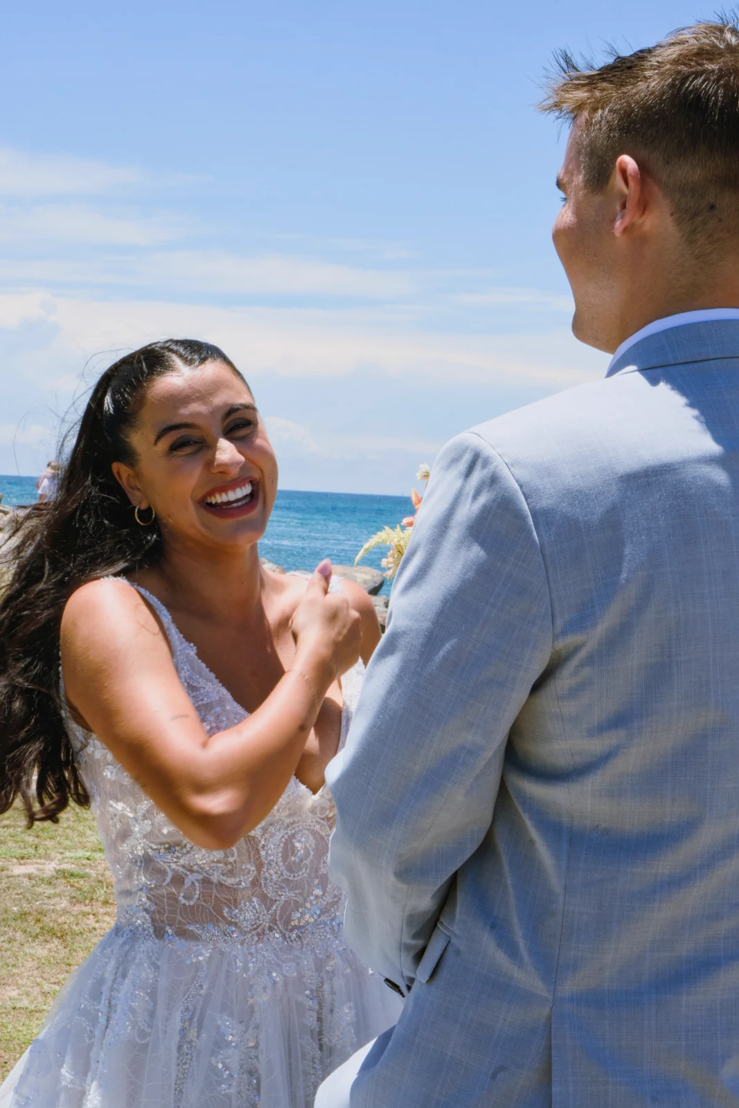 The bride smiling at the groom