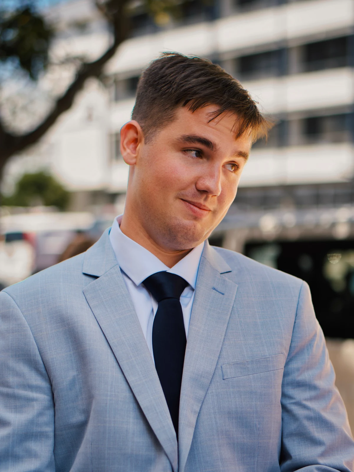 Portrait of the groom in a pale blue suit